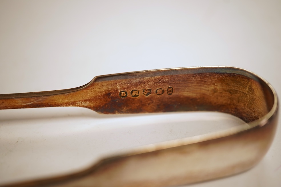 A pair of George III silver Old English pattern berry spoons, by Eley, Fearn & Chawner, London, 1810, 22.1cm, together with three Victorian silver fiddle pattern teaspoons, 6.8oz, together with a pair of plated sugar ton